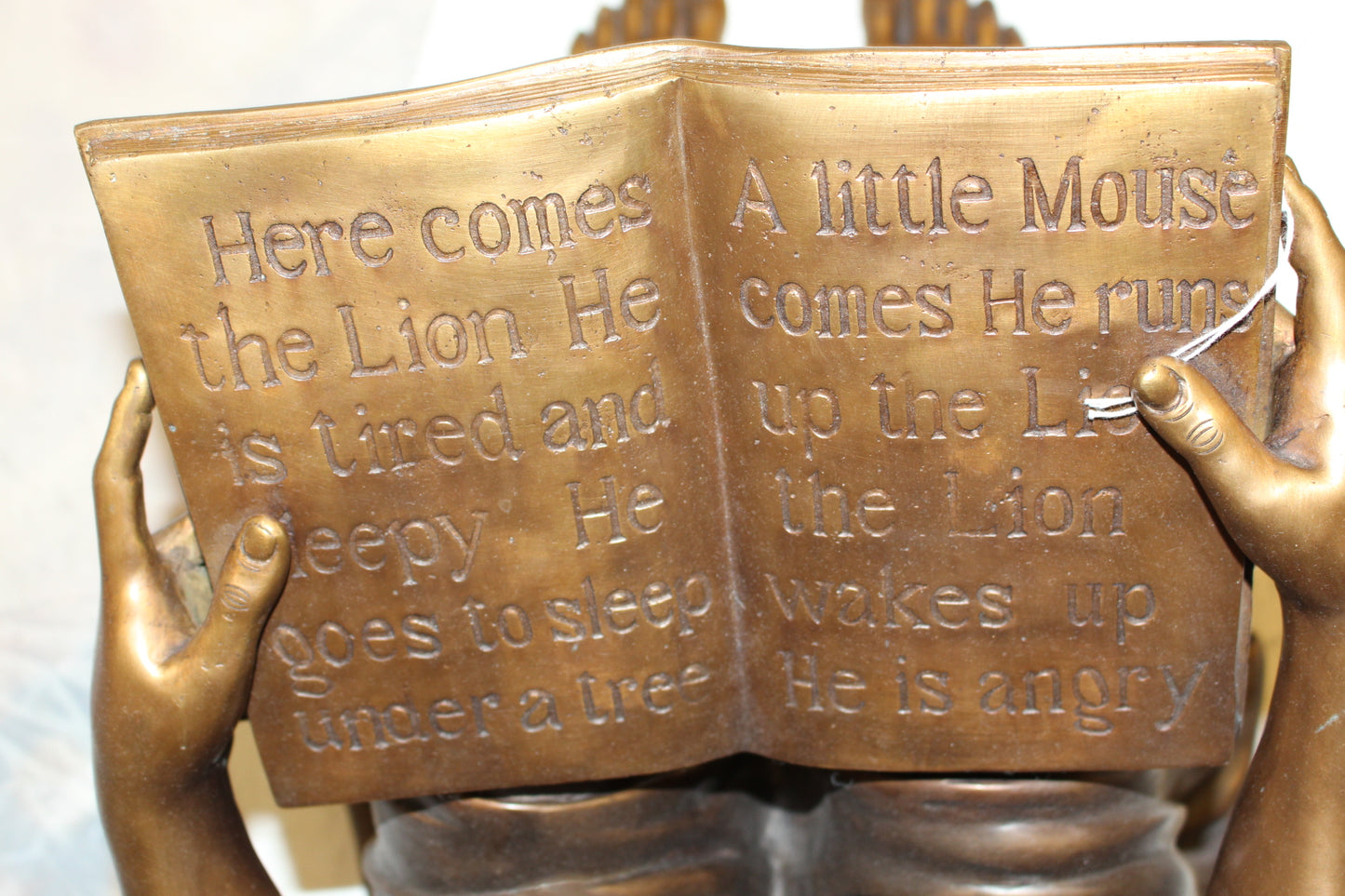 Girl Sitting and Reading a Book Bronze Statue - Size: 23"L x 15"W x 24"H.