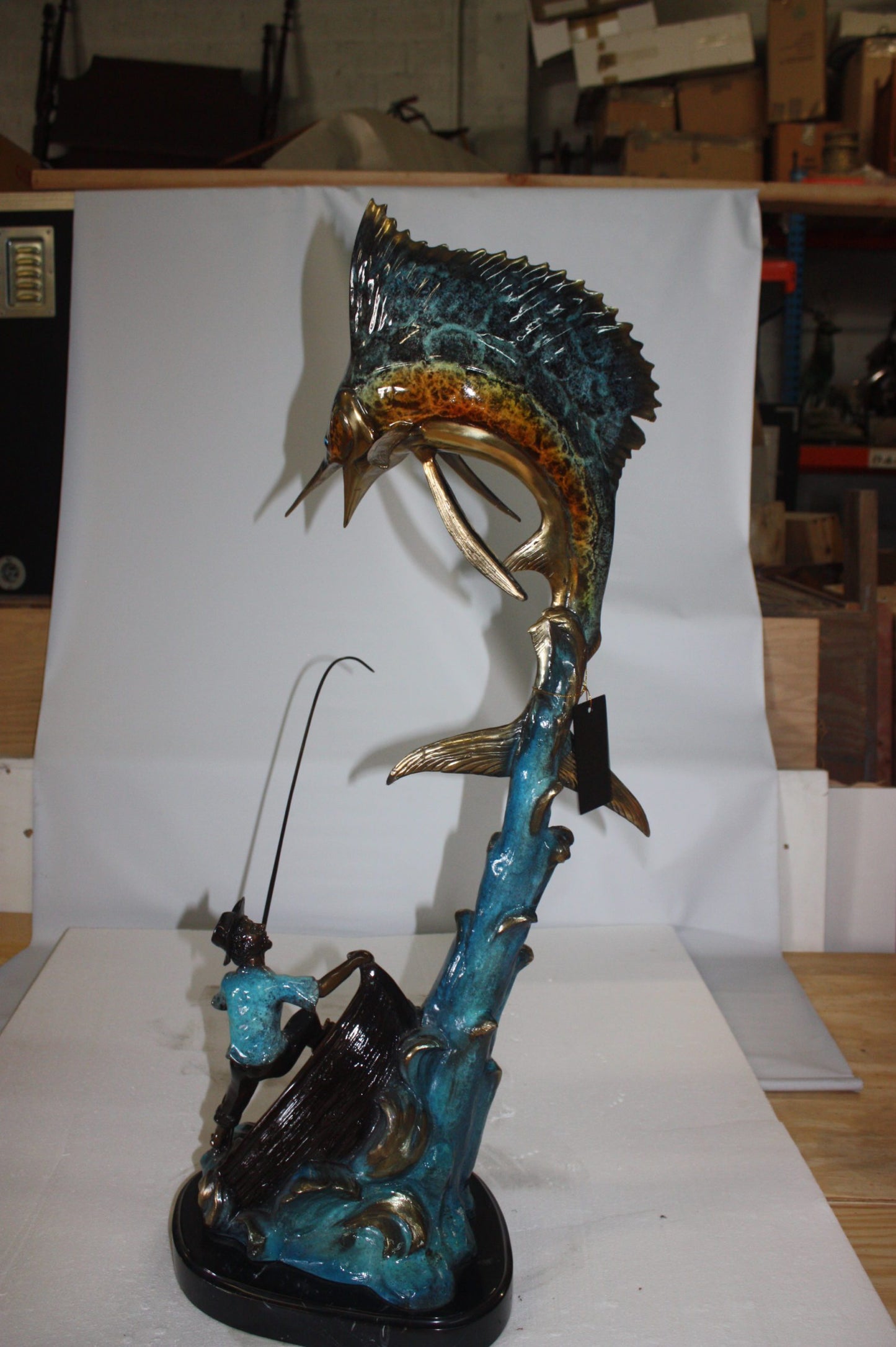 Old man on boat Or fishing man -  Size: 16"L x 12"W x 40"H.