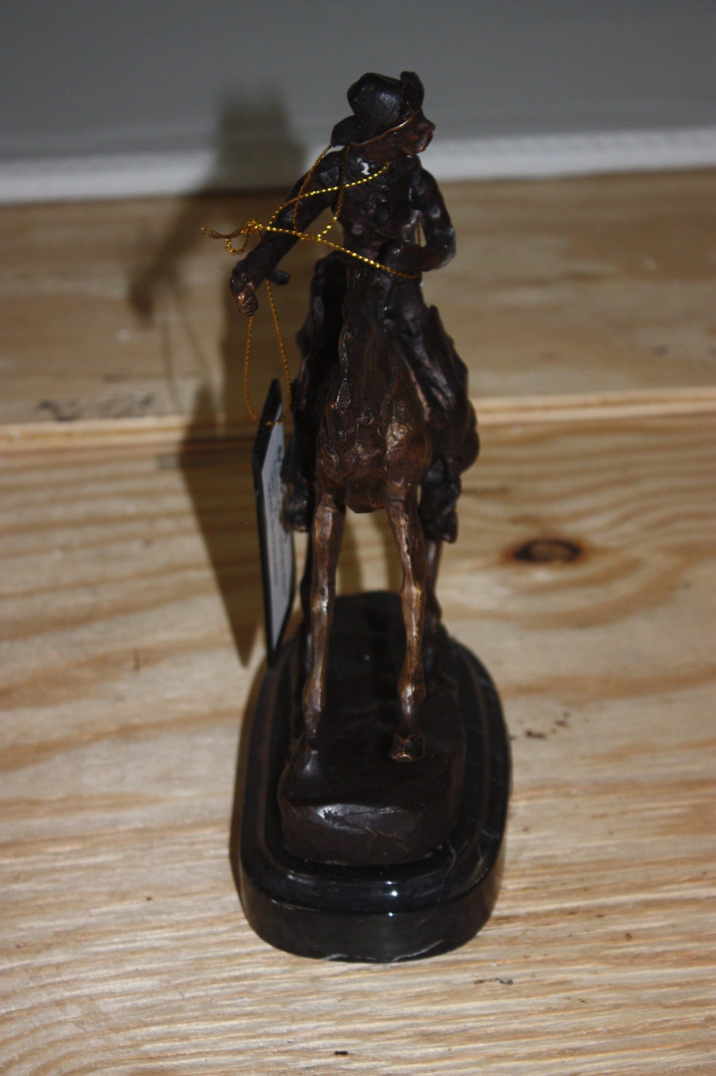 Remington Cowboy on marble Bronze Statue - Size: 10"L x 3.5"W x 10"H.