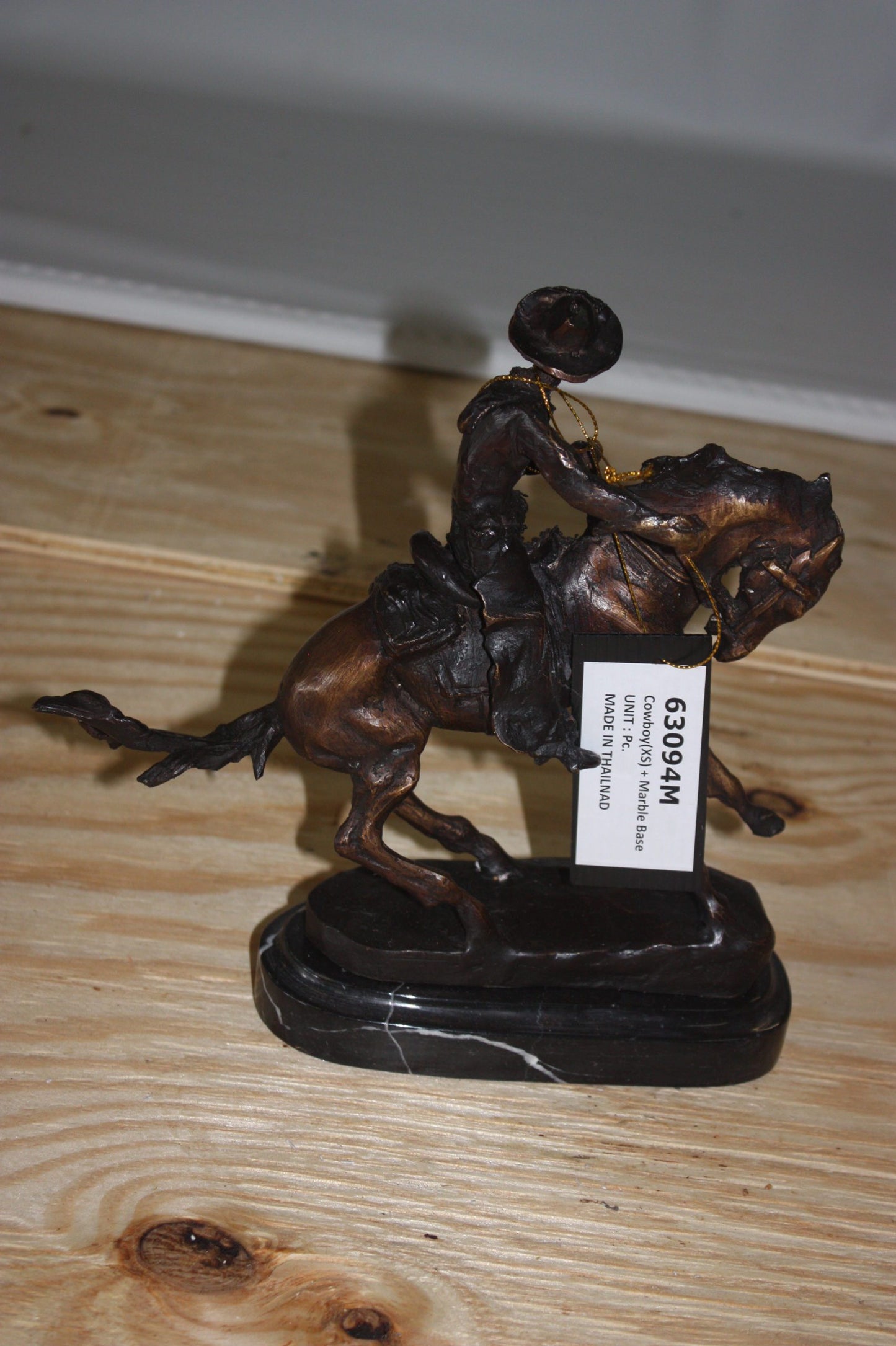 Remington Cowboy on marble Bronze Statue - Size: 10"L x 3.5"W x 10"H.