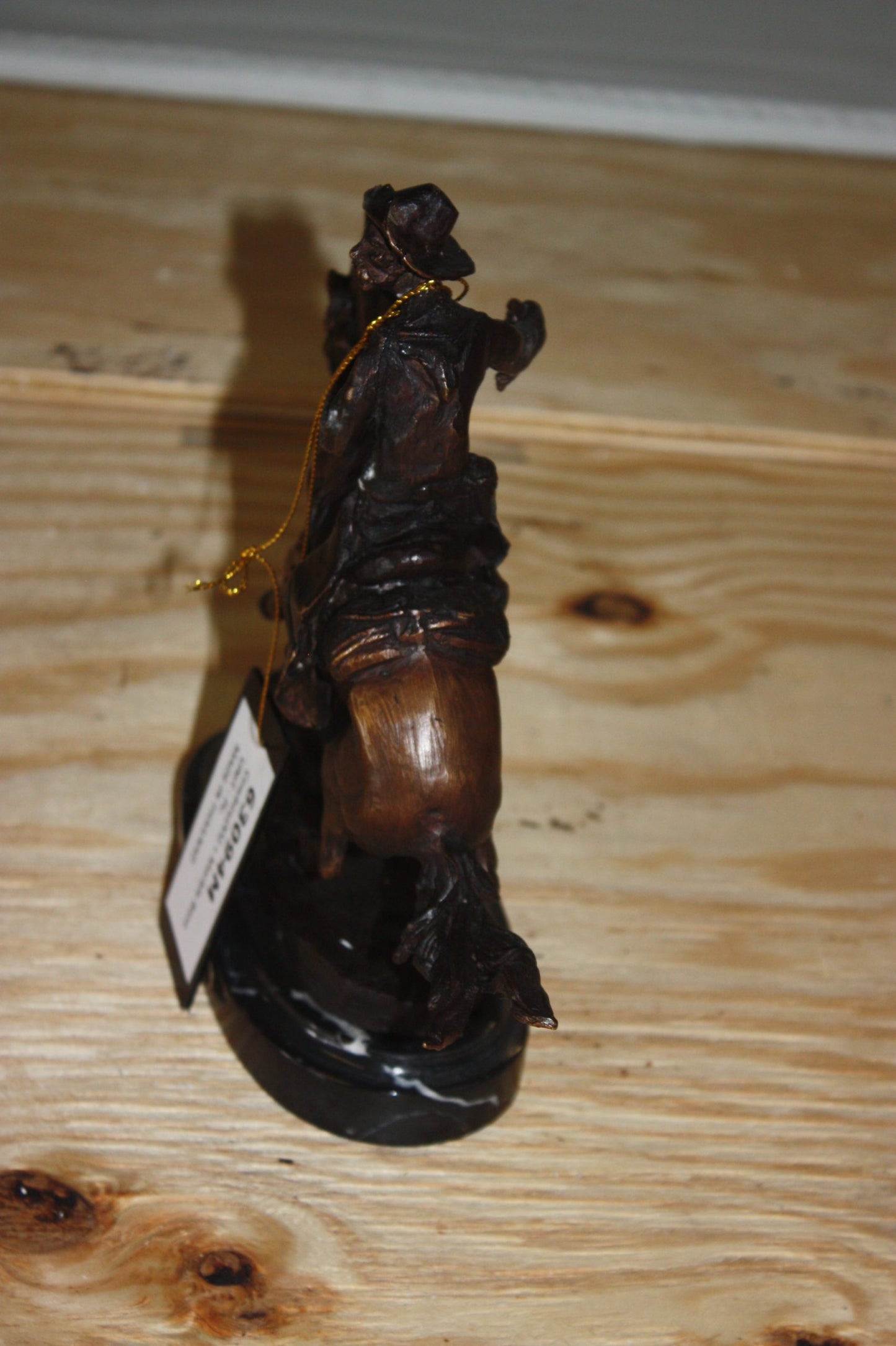 Remington Cowboy on marble Bronze Statue - Size: 10"L x 3.5"W x 10"H.