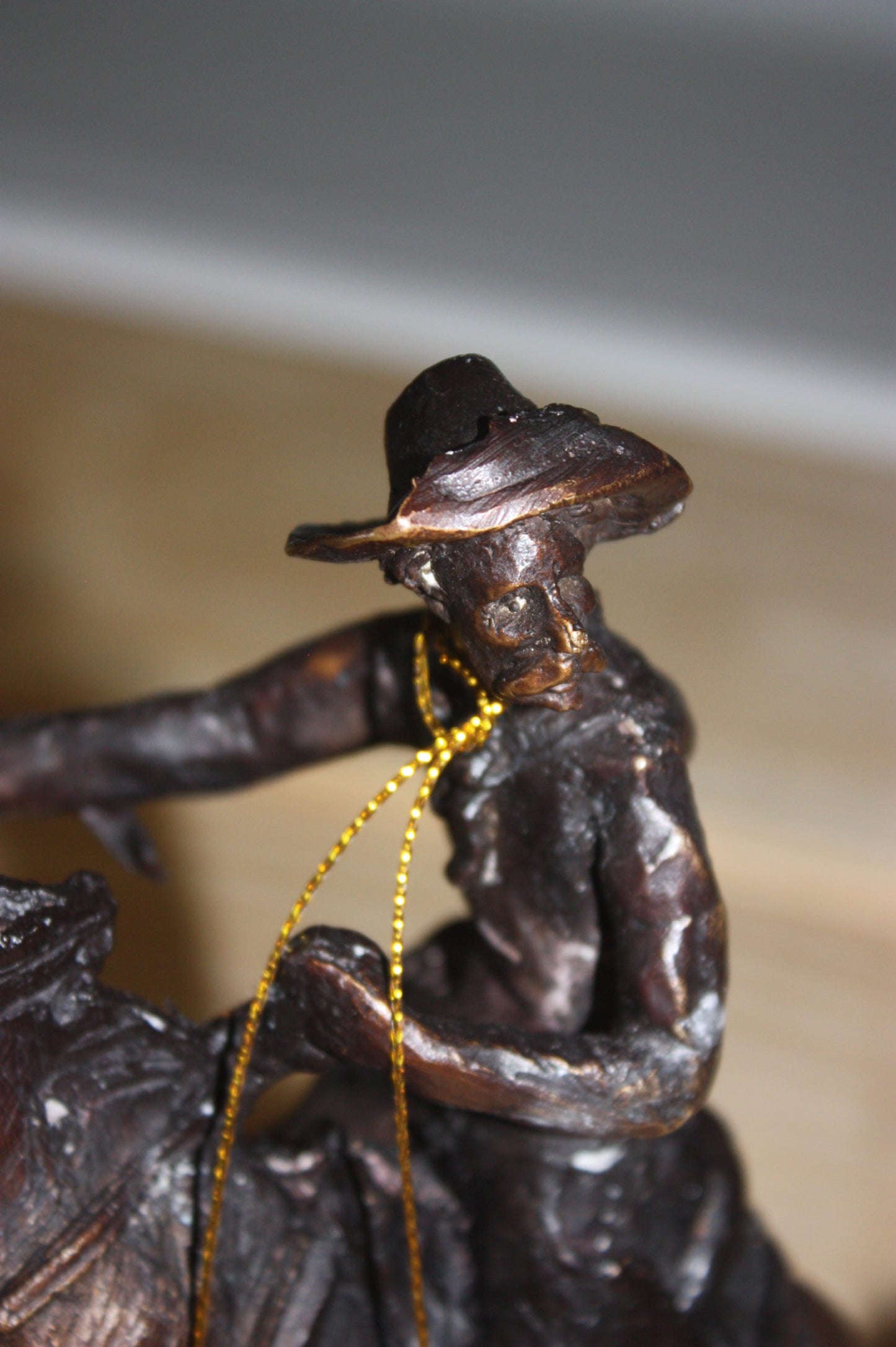 Remington Cowboy on marble Bronze Statue - Size: 10"L x 3.5"W x 10"H.