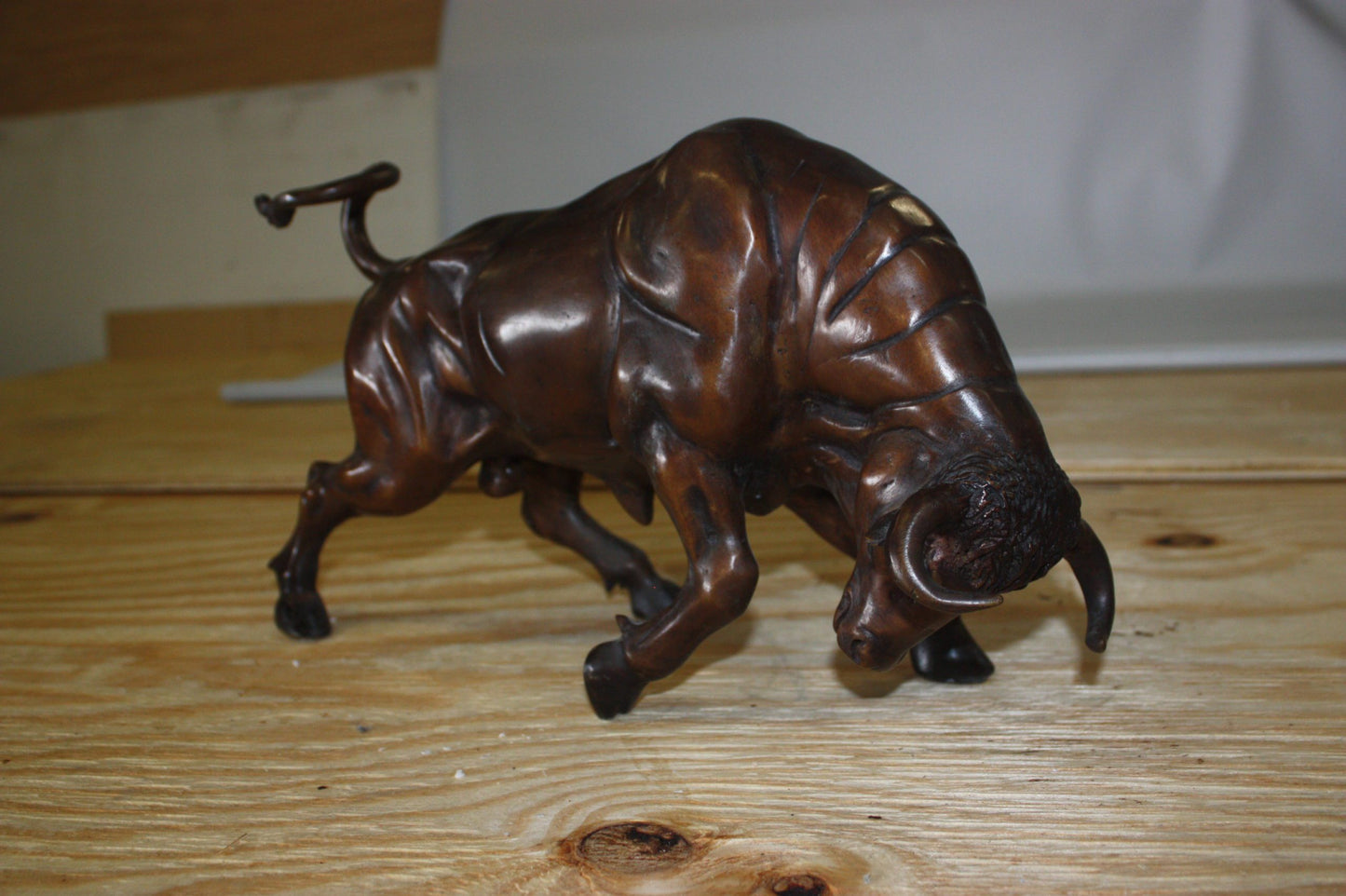 Wall street bull - small, Bronze Statue - Size: 15"L x 4"W x 10"H.