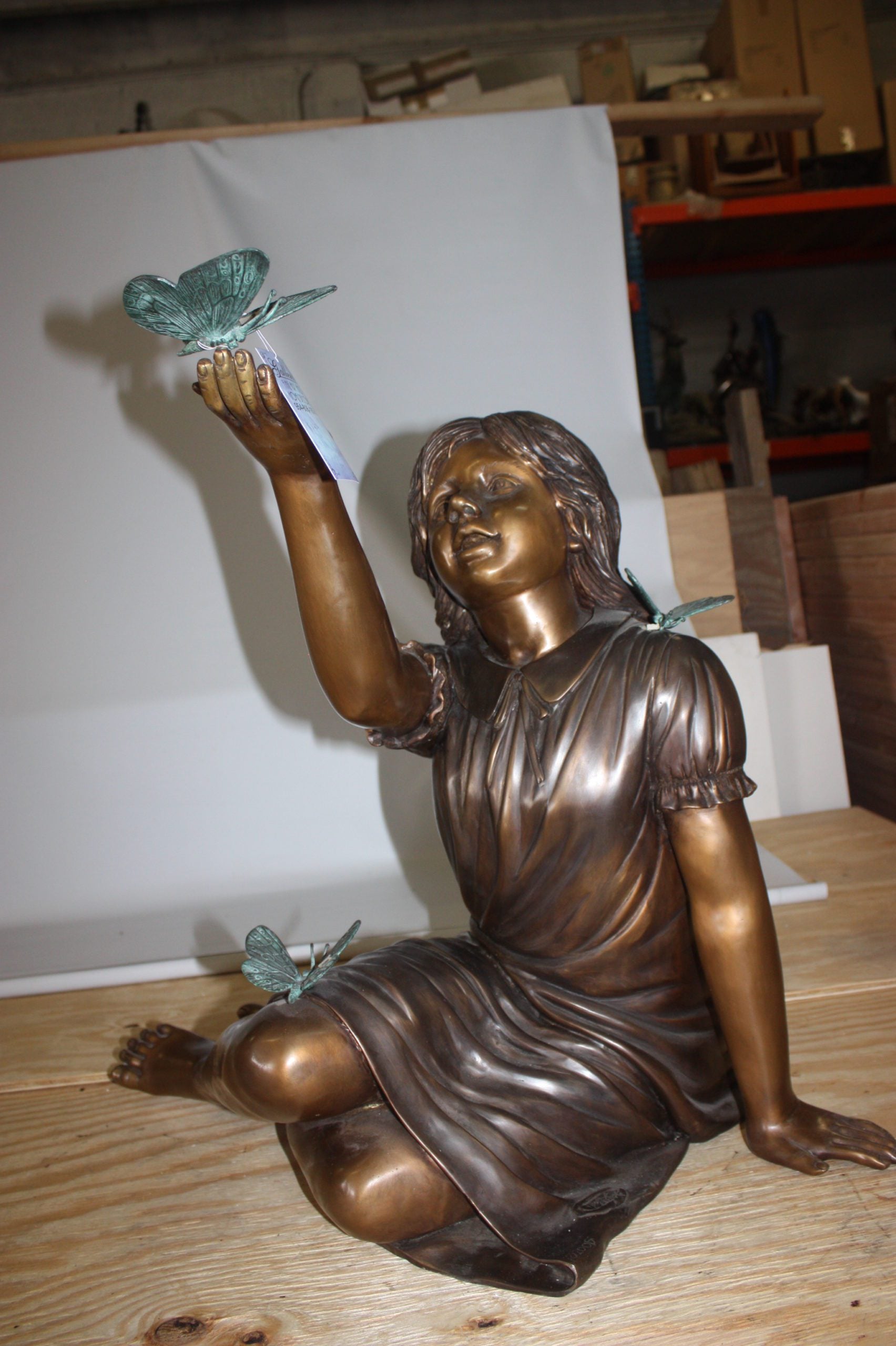 Girl with butterflies  - Bronze Statue -  Size: 27"L x 17"W x 24"H.