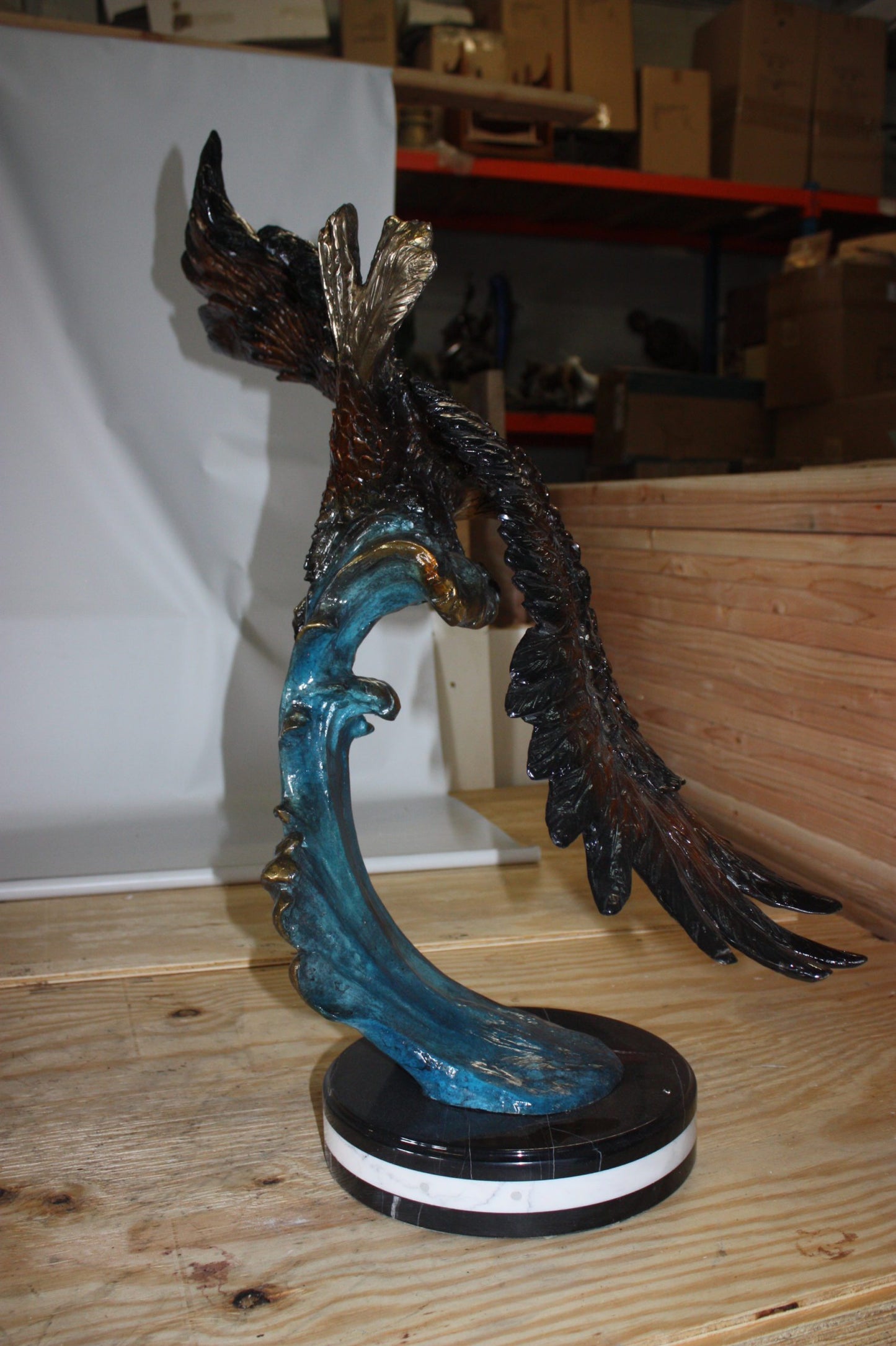 Eagle on a wave - Bronze Statue - Size: 32"L x 12"W x 34"H.