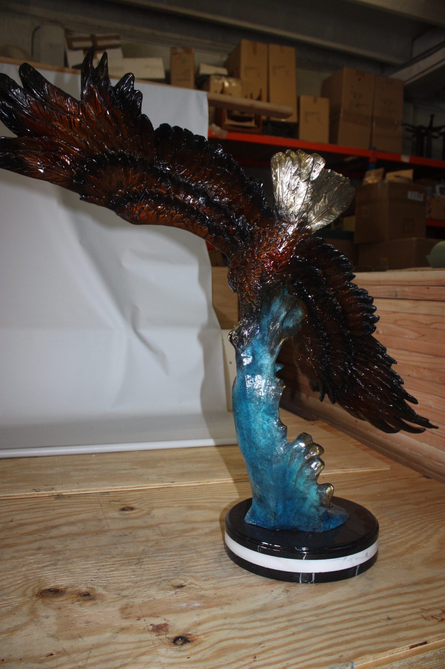 Eagle on a wave - Bronze Statue - Size: 32"L x 12"W x 34"H.