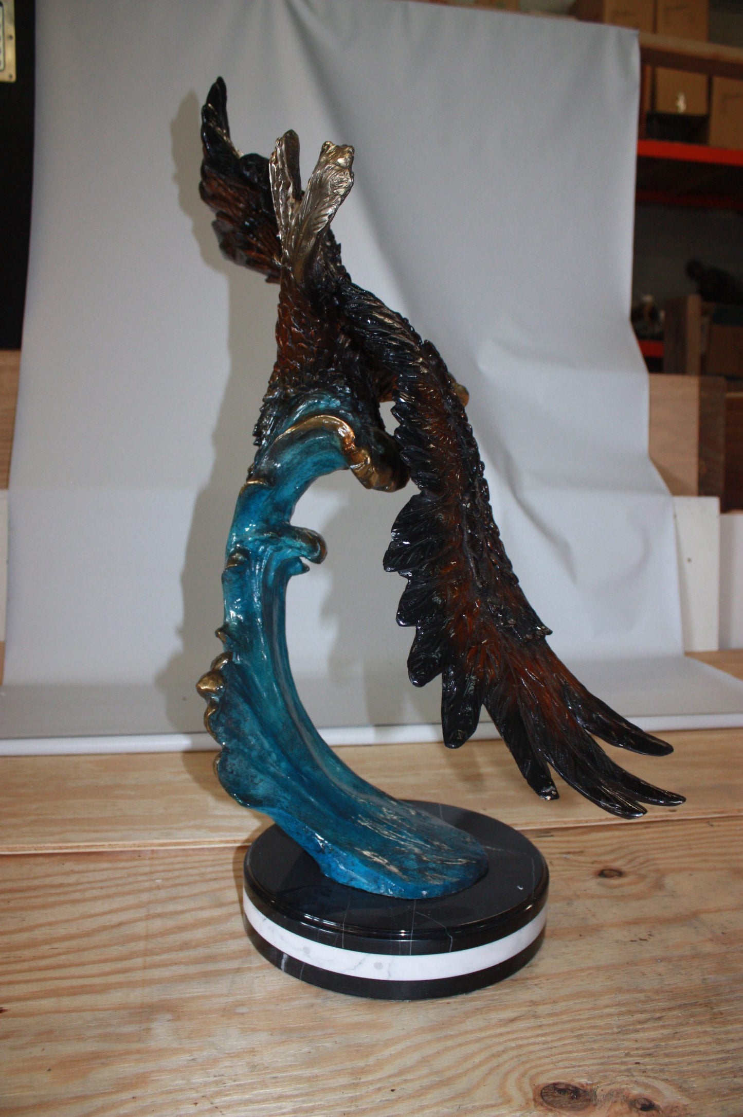 Eagle on a wave - Bronze Statue - Size: 32"L x 12"W x 34"H.