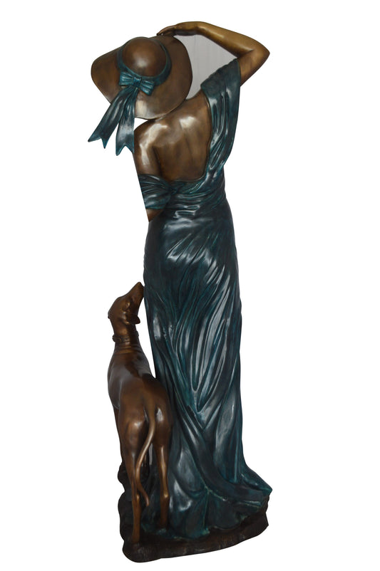 Lady With Her Dog Bronze Statue -  Size: 25"L x 22"W x 50"H.