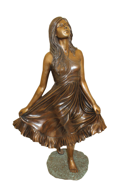 Lady holding her Skirt Bronze Statue - Size: 32"L x 17"W x 53"H.