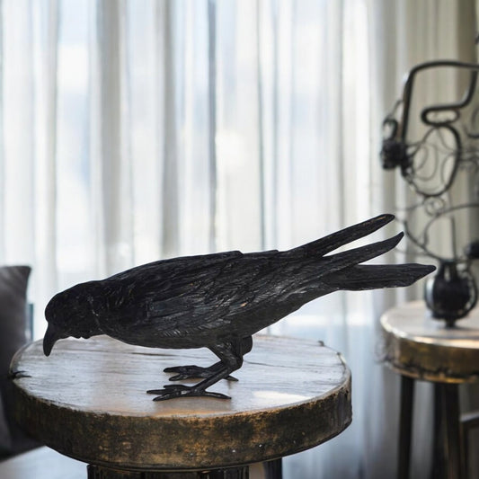 Raven with his head down Bronze Statue - Size: 22"L x 6"W x 11"H.