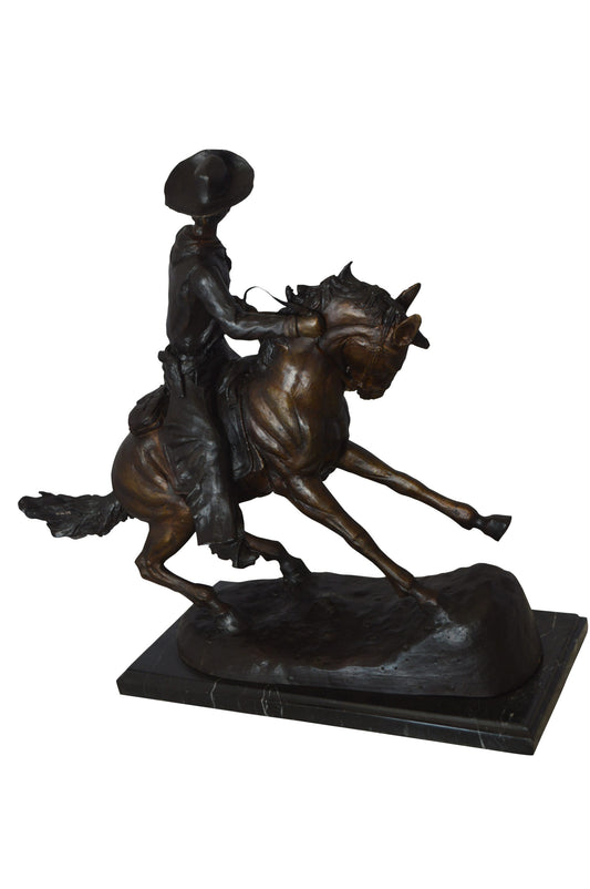 Remington Cowboy on marble Bronze Statue - Size: 24"L x 9"W x 23"H.
