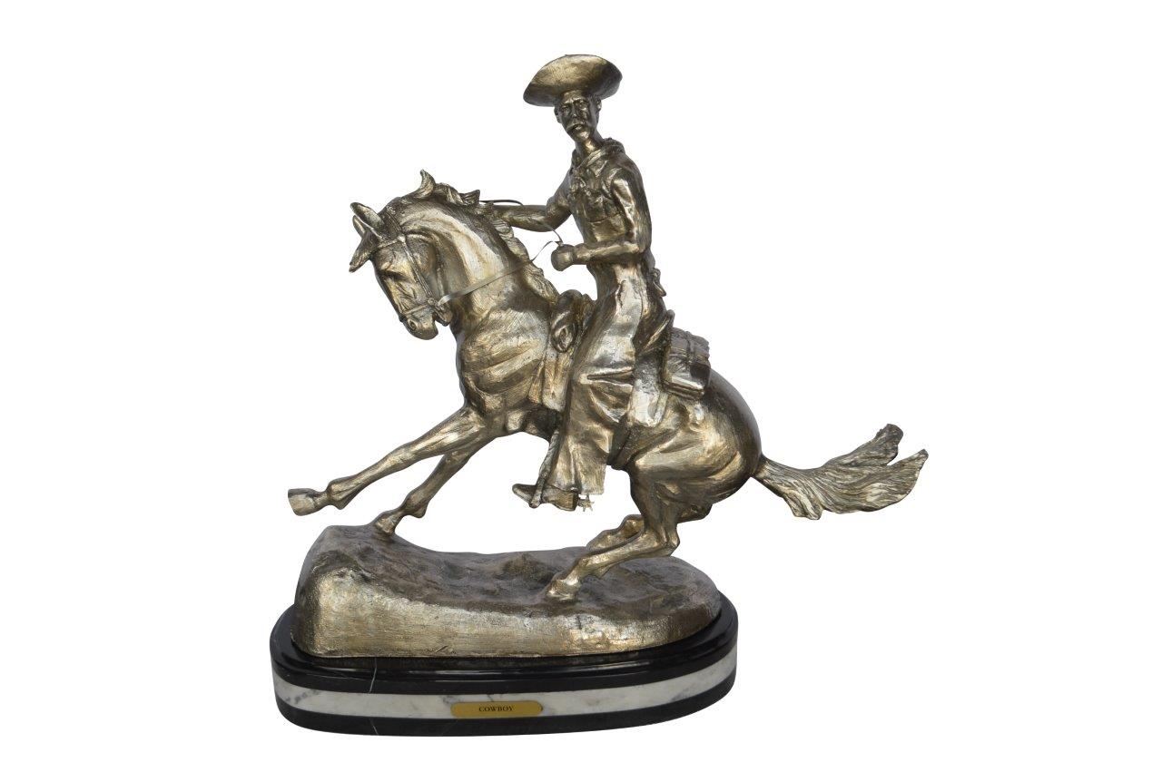 Remington Cowboy silver finished Bronze Statue - Size: 24"L x 9"W x 24"H.