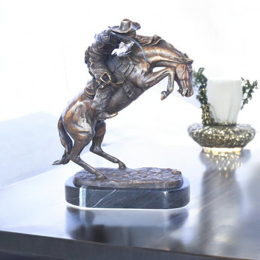 Remington replica Bronco Buster bronze statue - Size: 8"L x 10"W x 12"H.