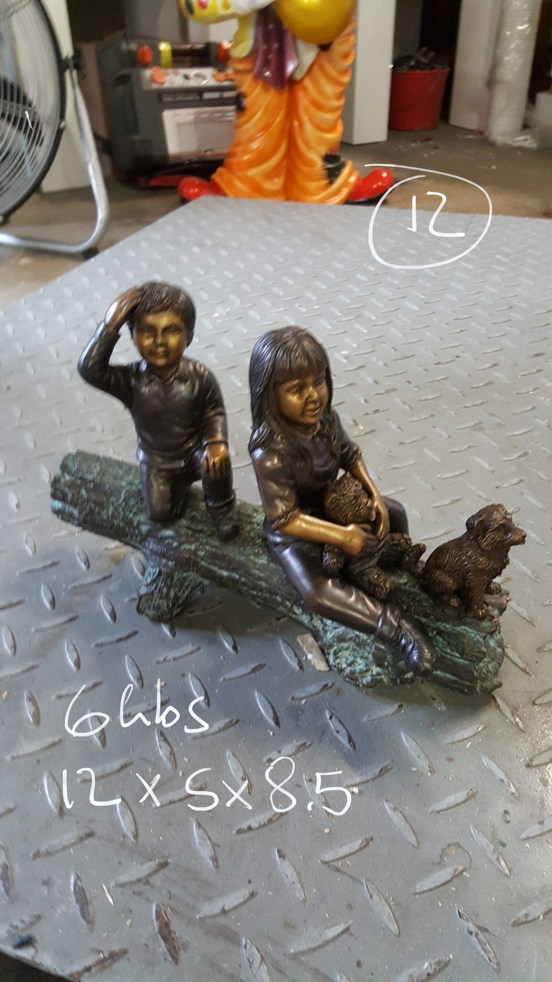 Two kids with dog on log Bronze Statue - Size: 12"L x 5"W x 8.5"H.