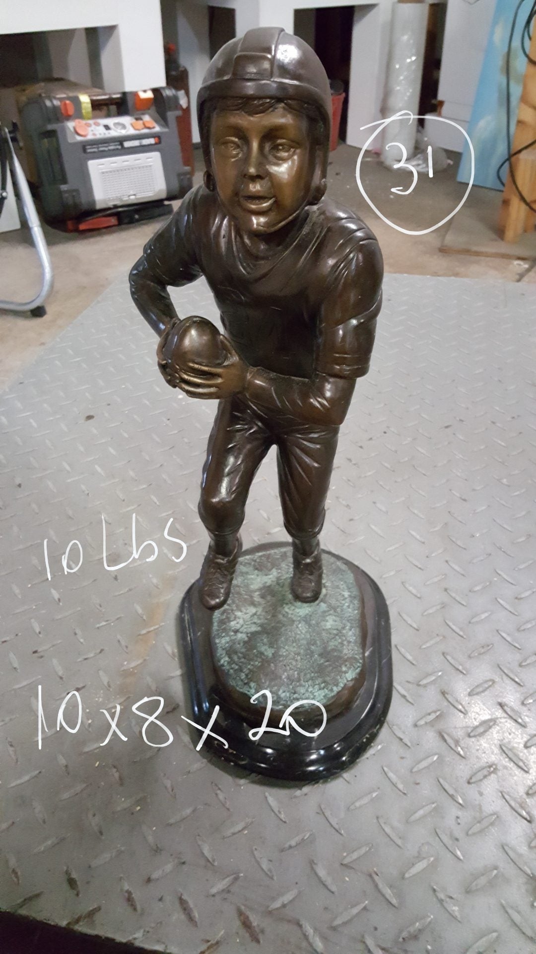 Boy playing football Bronze Statue - Size: 10"L x 8"W x 20"H.