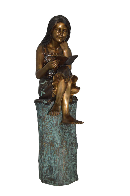 Sitting Girl on Log Reading a Book Bronze Statue -  Size: 19"L x 13"W x 48"H.