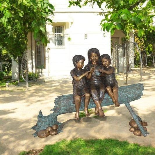 Three Children On Log Holding Bird Bronze Statue -  Size: 55"L x 18"W x 38"H.