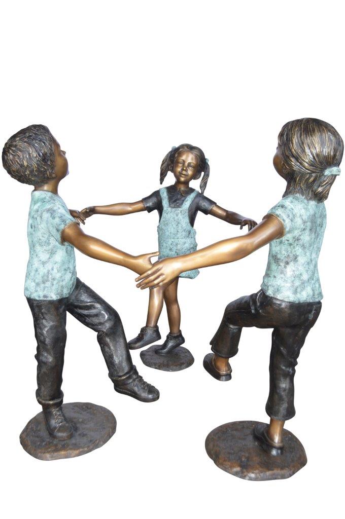 Three children happily holding hands bronze statue - Size: 31"L x 19"W x 41"H.
