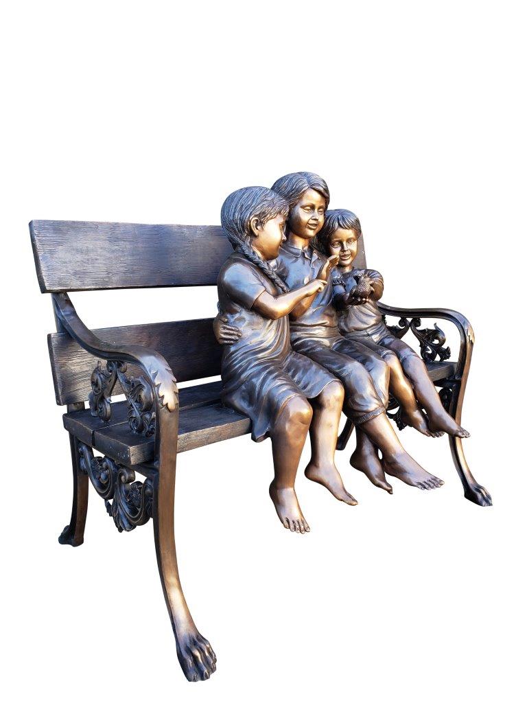 Three kids on a Bench Holding a Bird Bronze Statue - Size: 40"L x 30"W x 33"H.