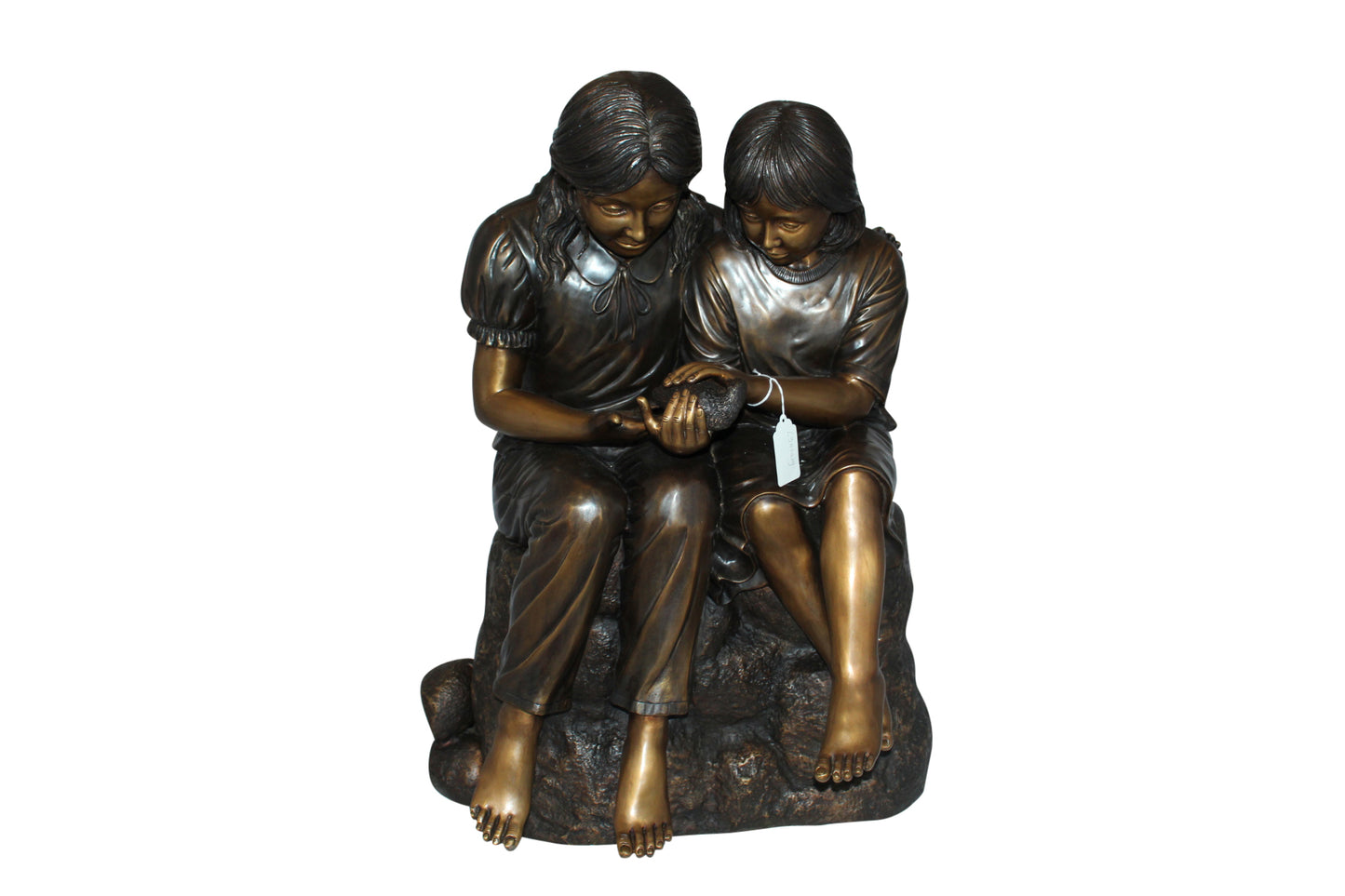 Two kids holding a bird Bronze Statue - Size: 18"L x 26"W x 34"H.