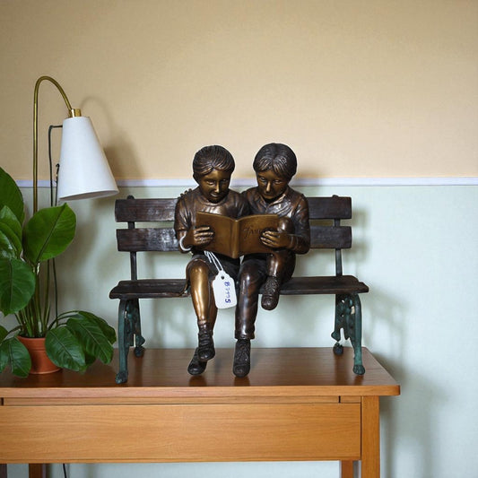 Two kids on Bench Reading A Book - Bronze Statue
