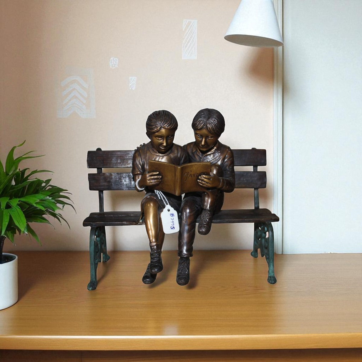 Two kids on Bench Reading A Book - Bronze Statue