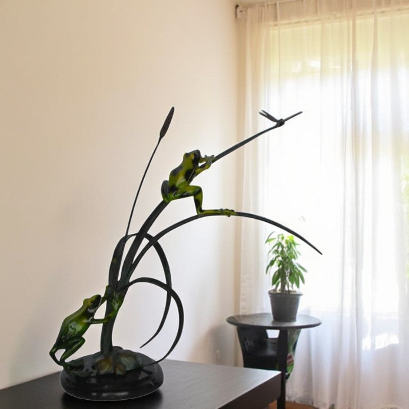Two Green Frogs catching a dragonfly Bronze Statue - Size: 17"L x 10"W x 13"H.