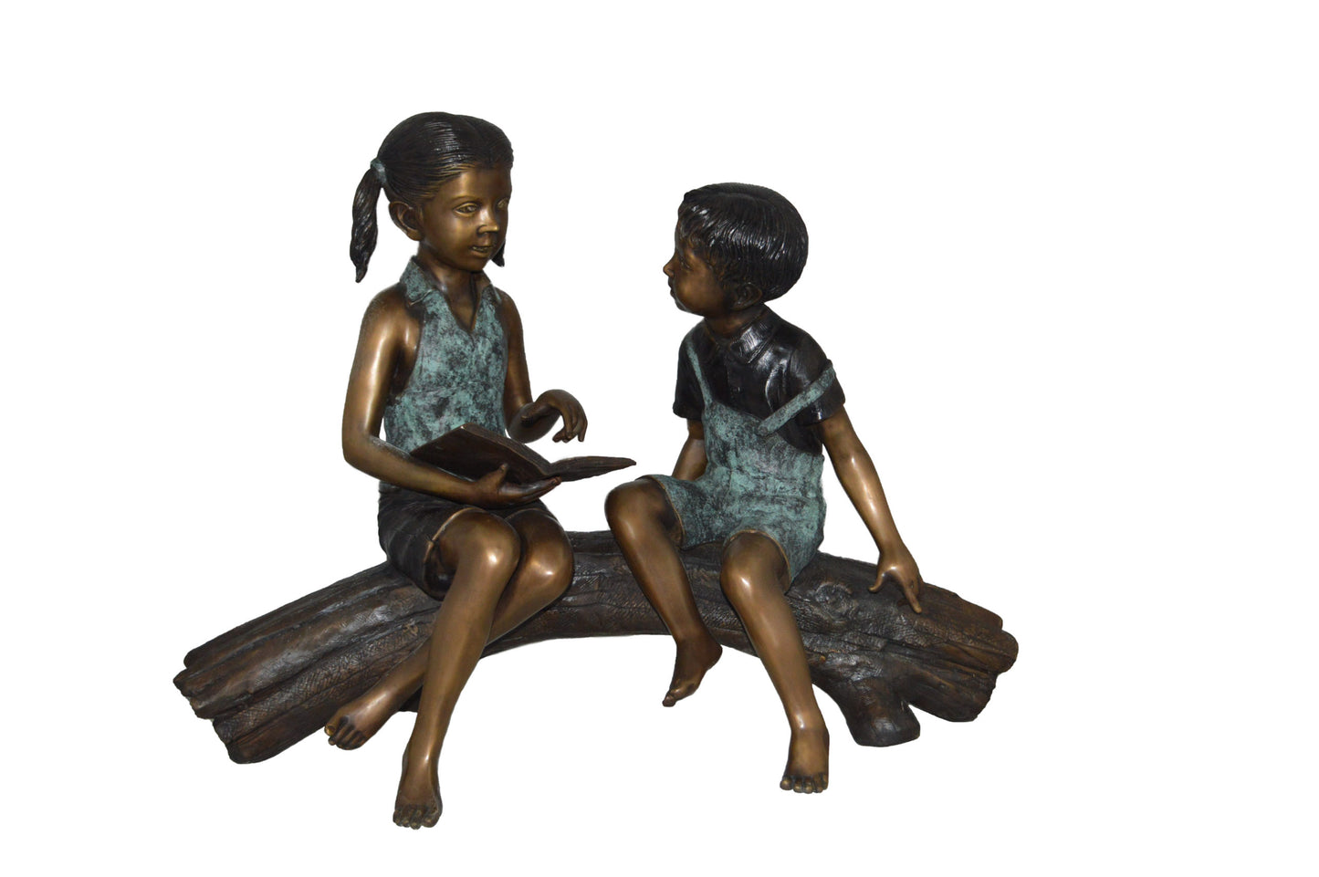 Boy and Girl on a tree log reading Bronze Statue - Size: 37"L x 14"W x 27"H.