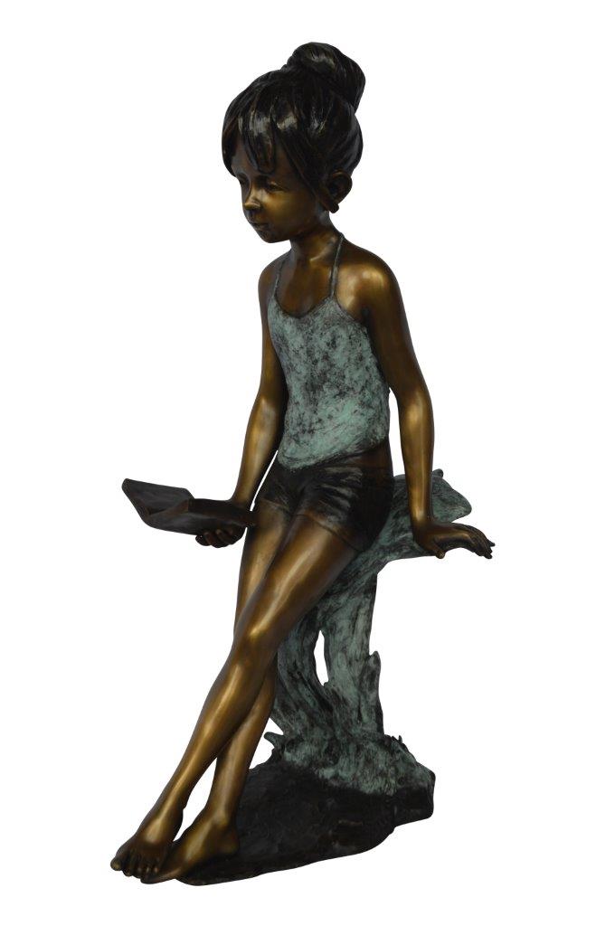 Girl sitting and reading a book bronze statue - Size: 19"L x 15"W x 36"H.