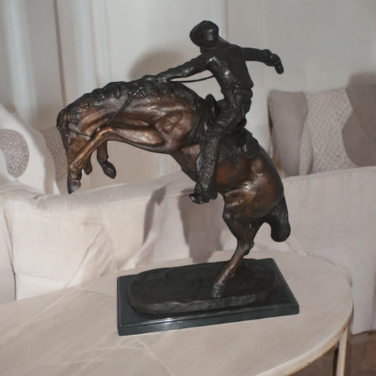 Wooly Chaps Bronze Statue by Remington - Size: 19"L x 11"W x 23"H.