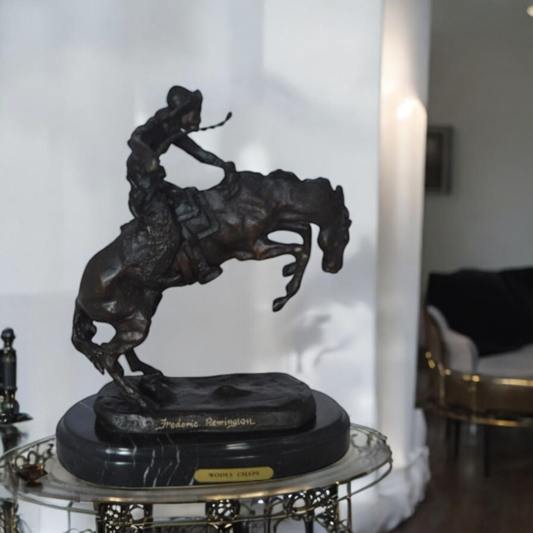 Wooly Chaps Bronze Statue by Remington 13H -  Size: 8"L x 3"W x 9"H.