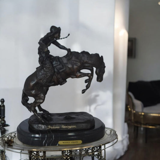 Wooly Chaps Bronze Statue by Remington 13H -  Size: 8"L x 3"W x 9"H.