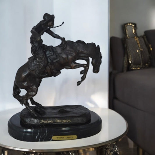 Wooly Chaps Bronze Statue by Remington 13H -  Size: 8"L x 3"W x 9"H.