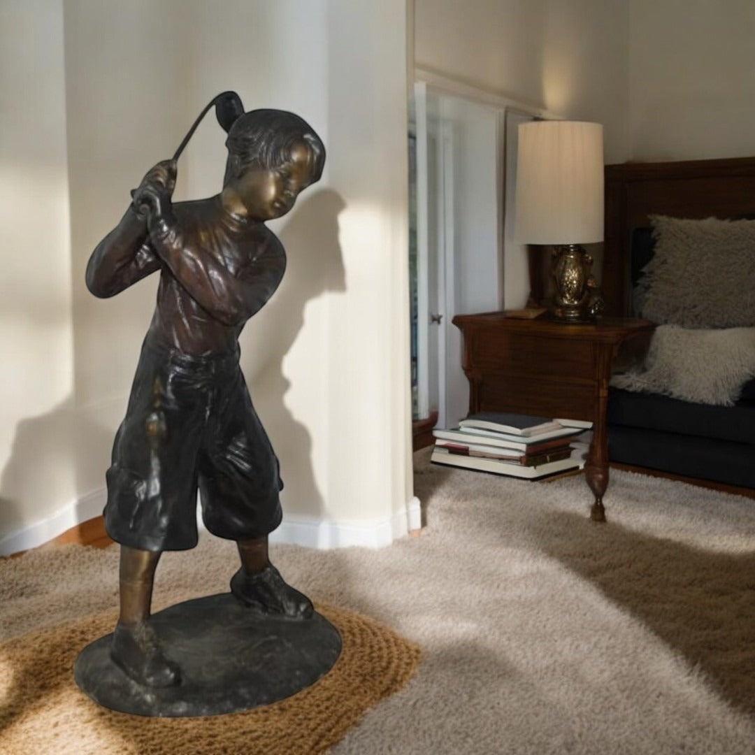 Young Boy Plays Golf Bronze Statue - Size: 19"L x 21"W x 45"H.
