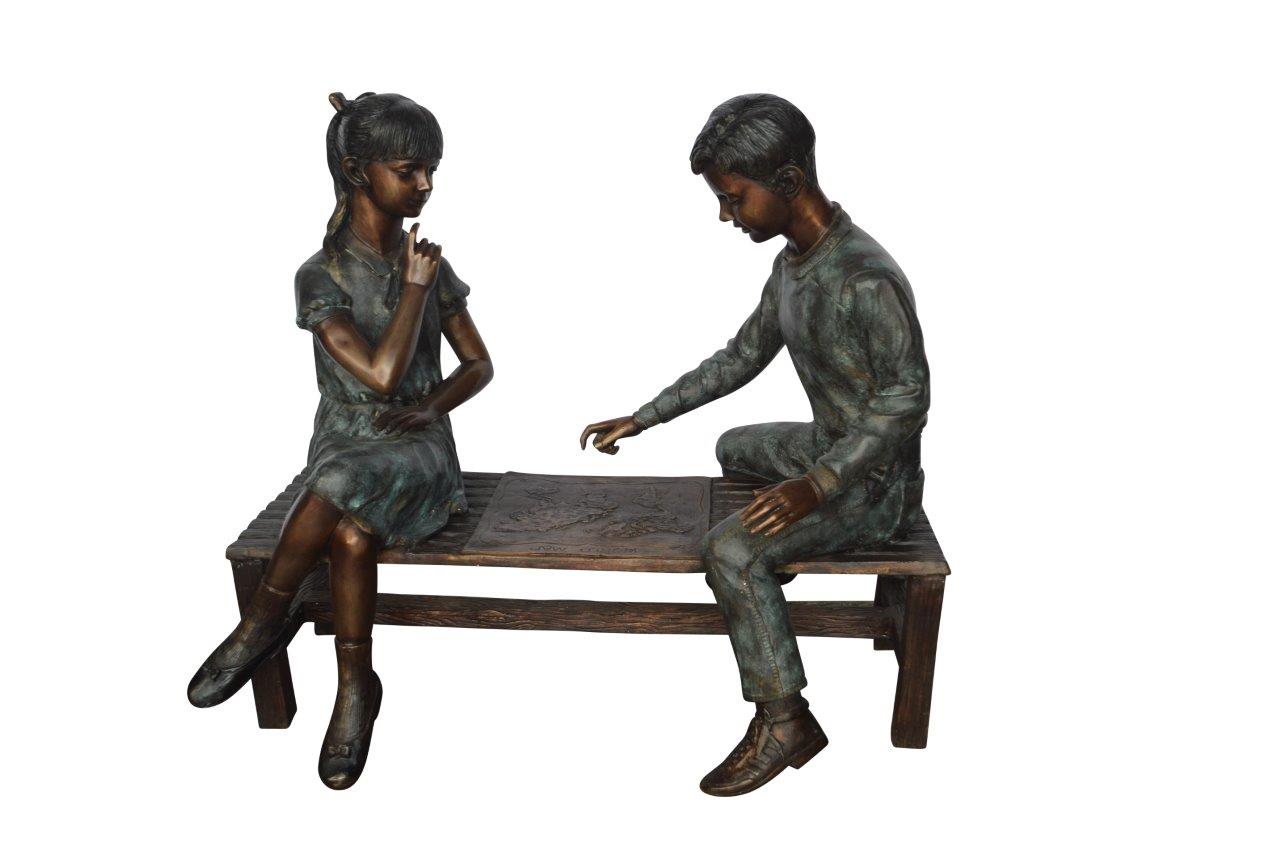Young Couple Reviewing a World Map Bronze Statue -  Size: 32"L x 47"W x 42"H.