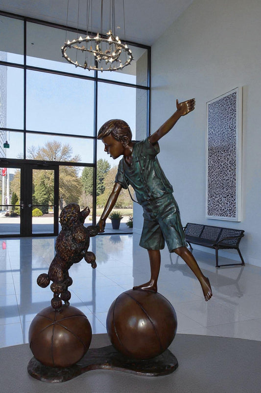 Boy and poodle balancing circus stars bronze statue - Size: 38" x 27" x 55"H.
