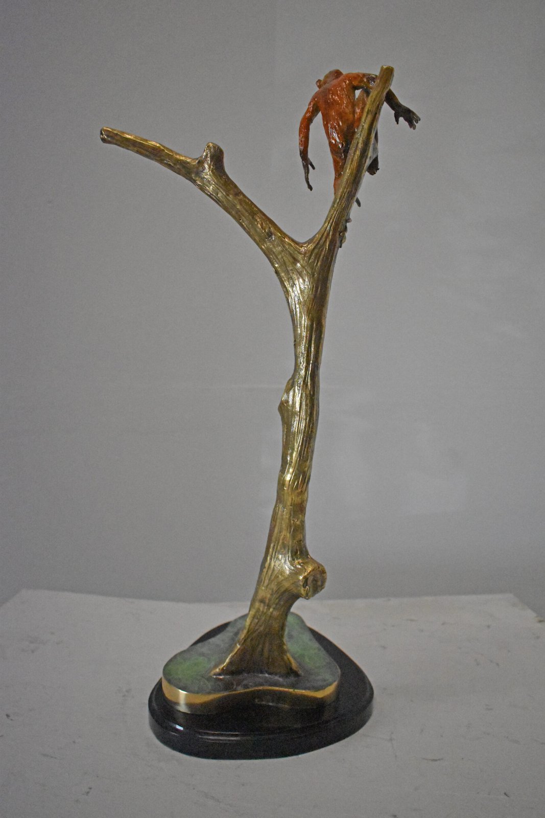 Colored Monkey Resting on a Tree Bronze Statue - Size: 12"L x 13"W x 27"H.