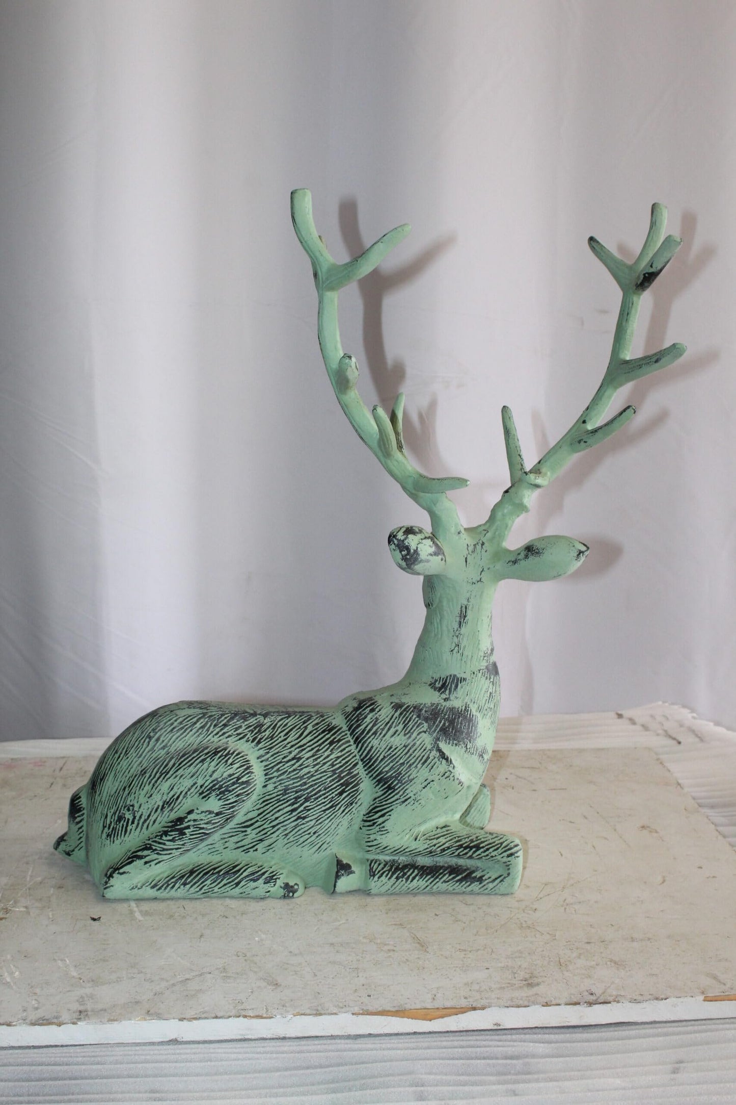 Aluminum Deer Statue Green Patina Resting on the ground 26" x 7" x 24"H
