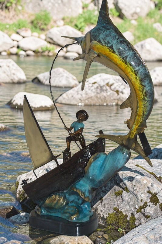 Old Man Fishing a Large Catch Bronze Statue - Size: 27"L x 13"W x 30"H.