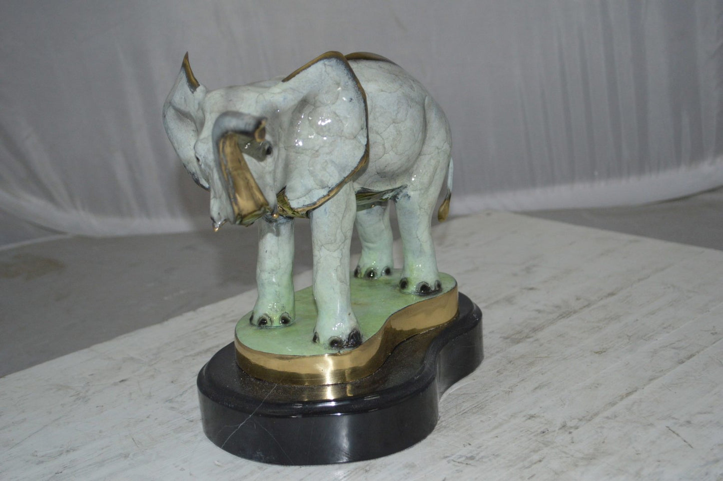 Elephant trunk Up Bronze Statue - Size: 16"L x 9"W x 10"H.