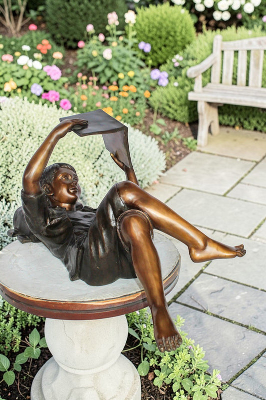 Nifao Bronze Boy Reading Statue – Large Handcrafted Lost Wax Sculpture of Young Boy Lying Back with Book – Detailed Child Figurine for Study, Library, Garden, or Home Déco 41" x 22" x 18"H