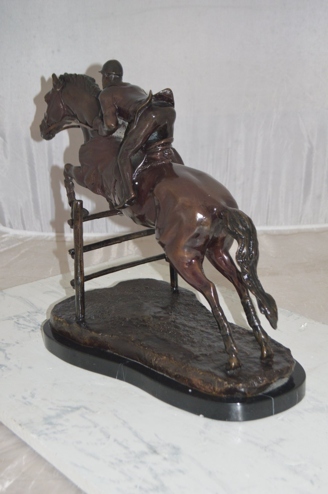 Jockey With Horse Jumping Over Hurdle Bronze Statue Medium 23"L x 10"W x 16"H.