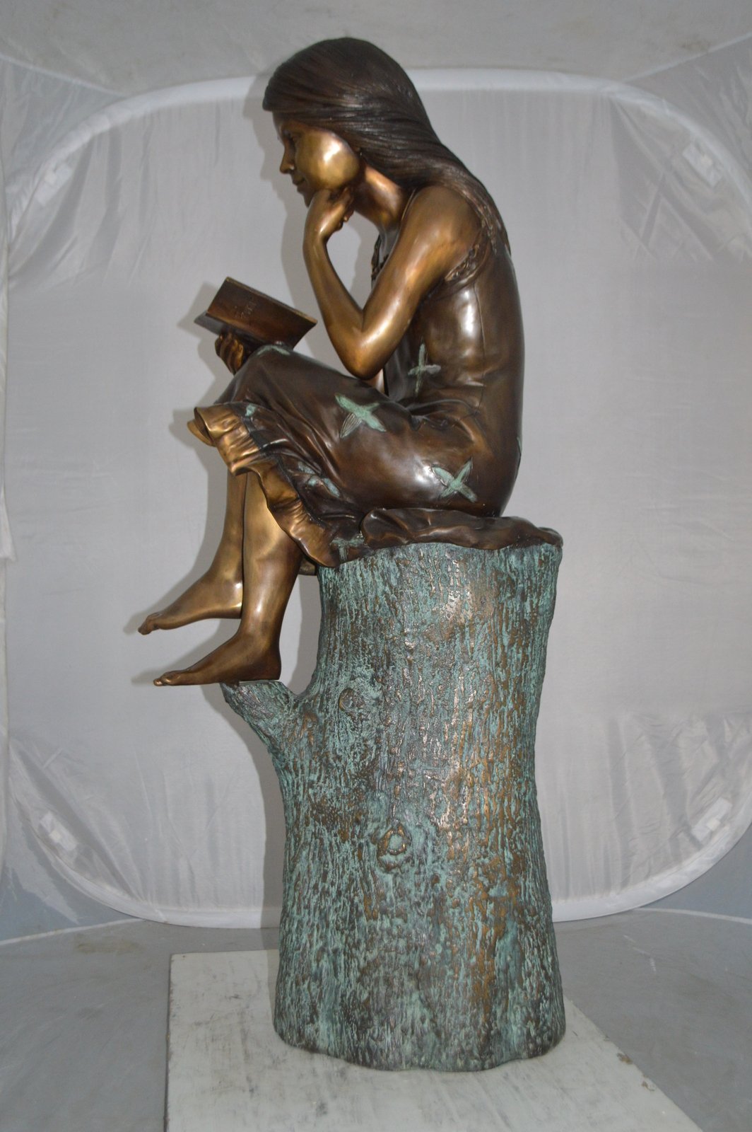 Sitting Girl on Log Reading a Book Bronze Statue - Size: 19"L x 13"W x 48"H.
