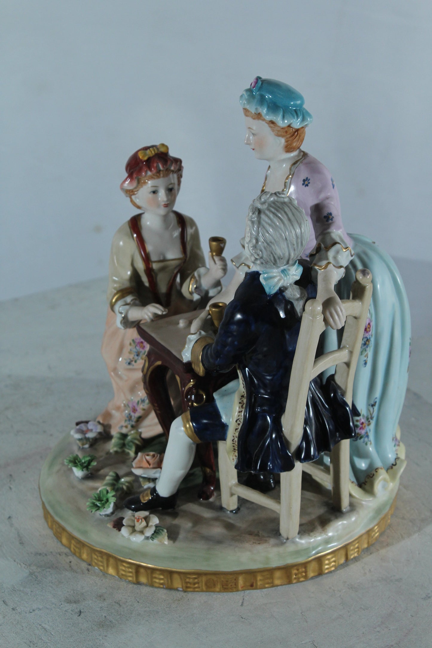 NIFAO Porcelain Figurine Group at Table with Cups 10"x10"x13"H
