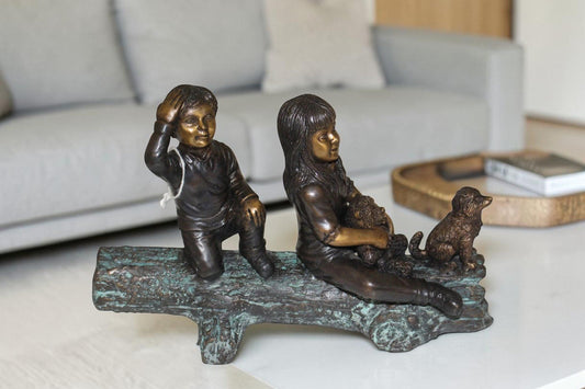Two kids with dog on log Bronze Statue - Size: 12"L x 5"W x 8.5"H.