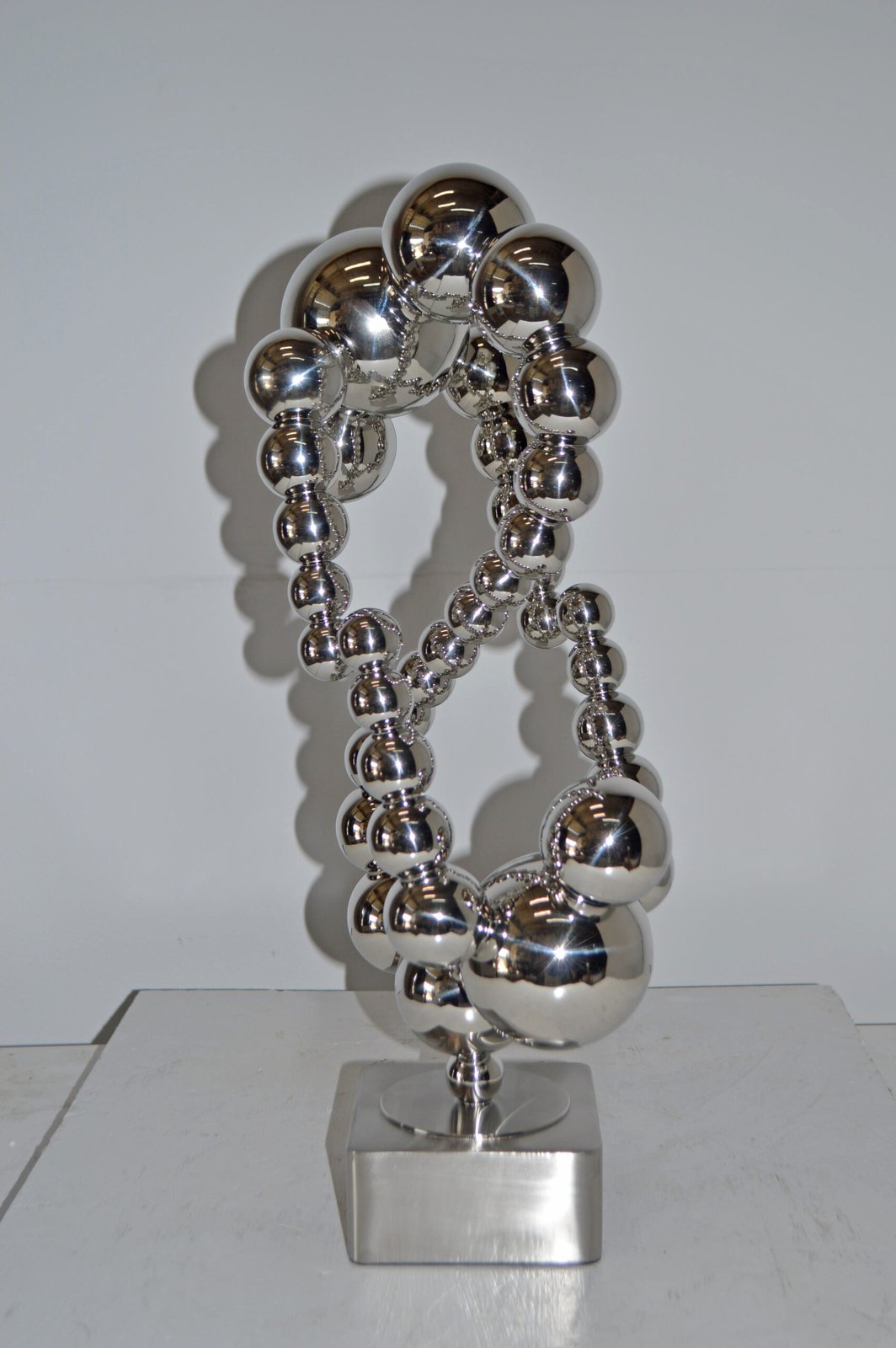 Modern Art Abstract Made of Chrome Balls Statue - Size: 11"L x 10"W x 22"H.