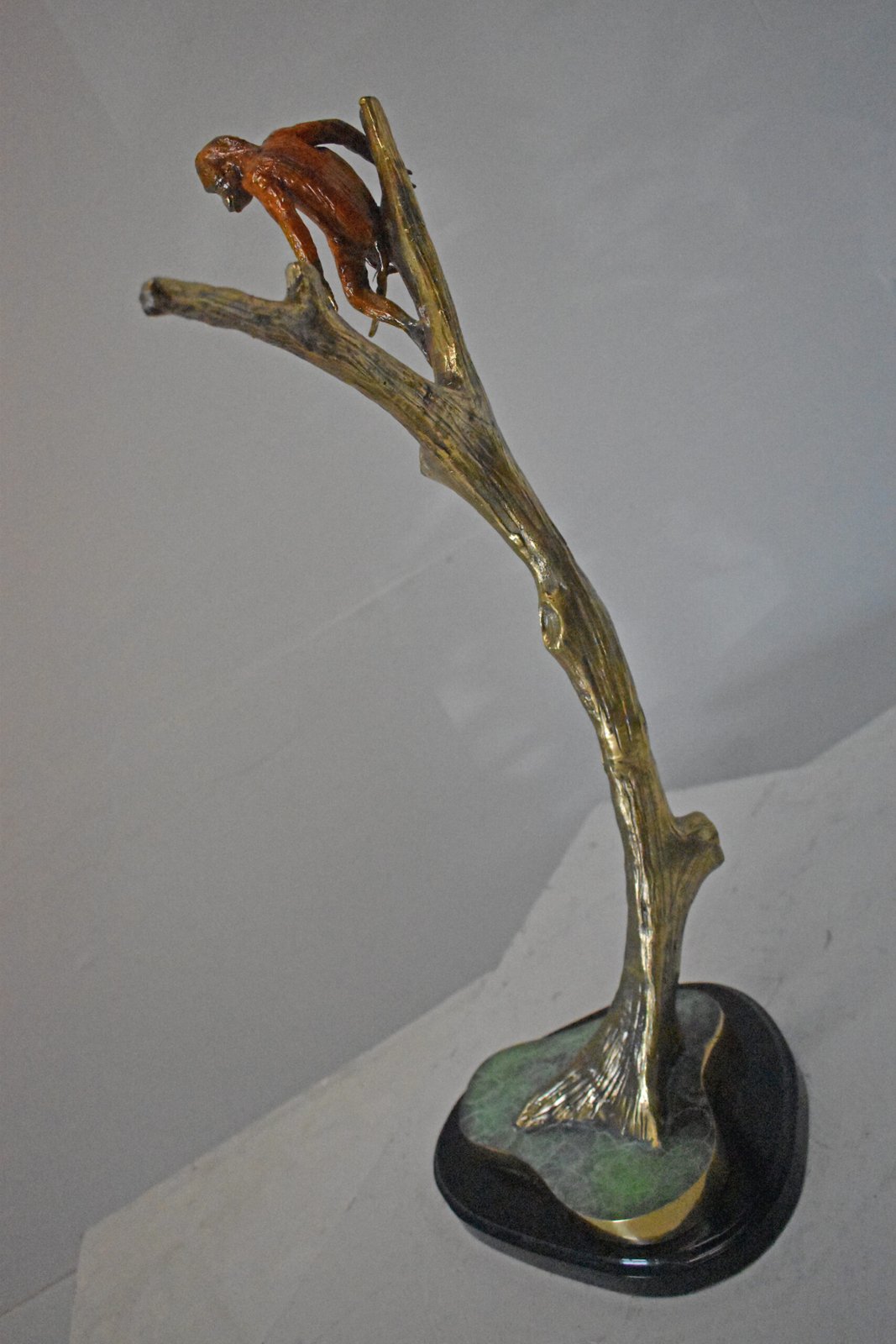 Colored Monkey Resting on a Tree Bronze Statue - Size: 12"L x 13"W x 27"H.