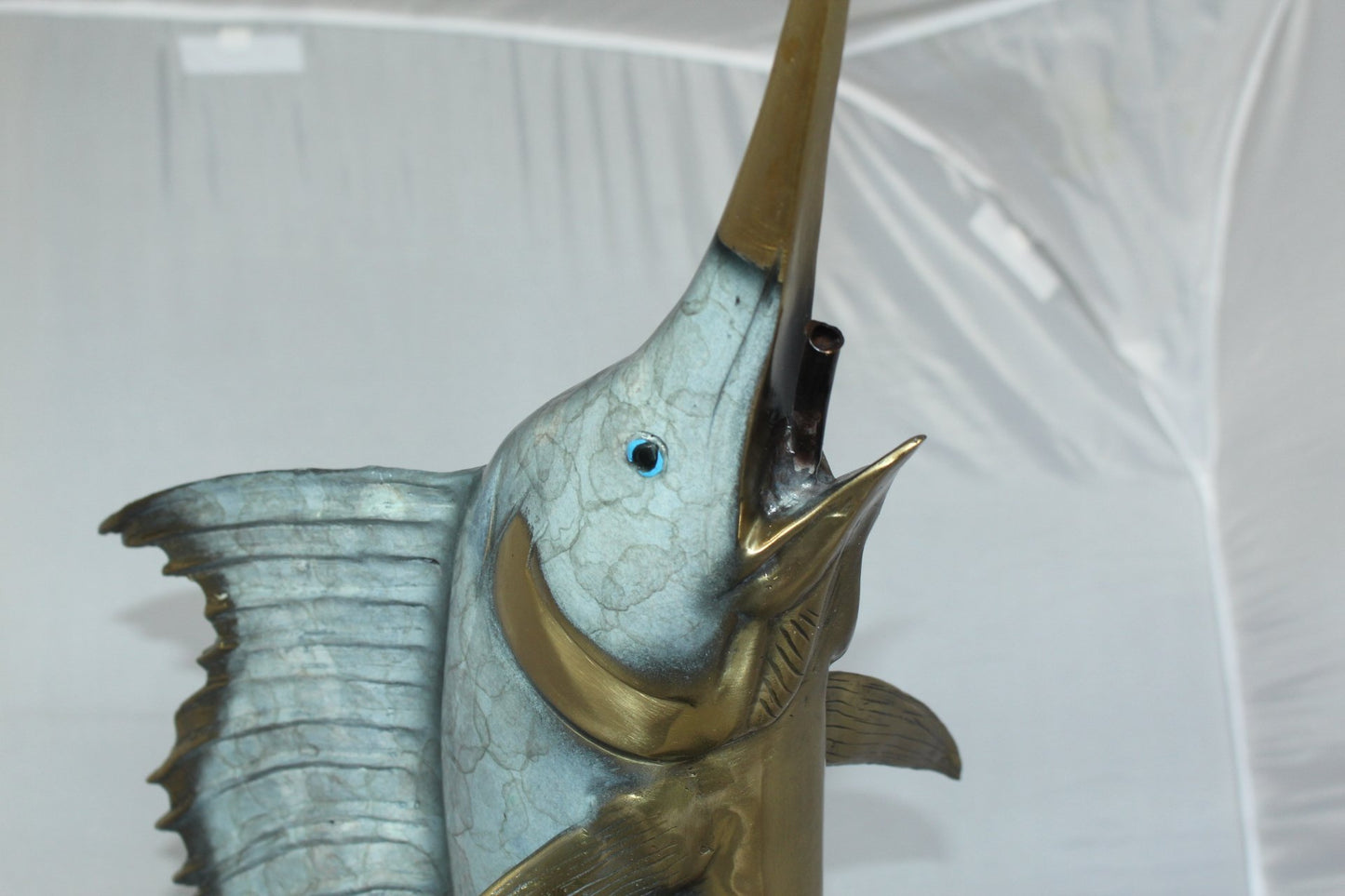 One Sailfish Jumping of the ware - Bronze Statue - Size: 16"L x 16"W x 39"H.