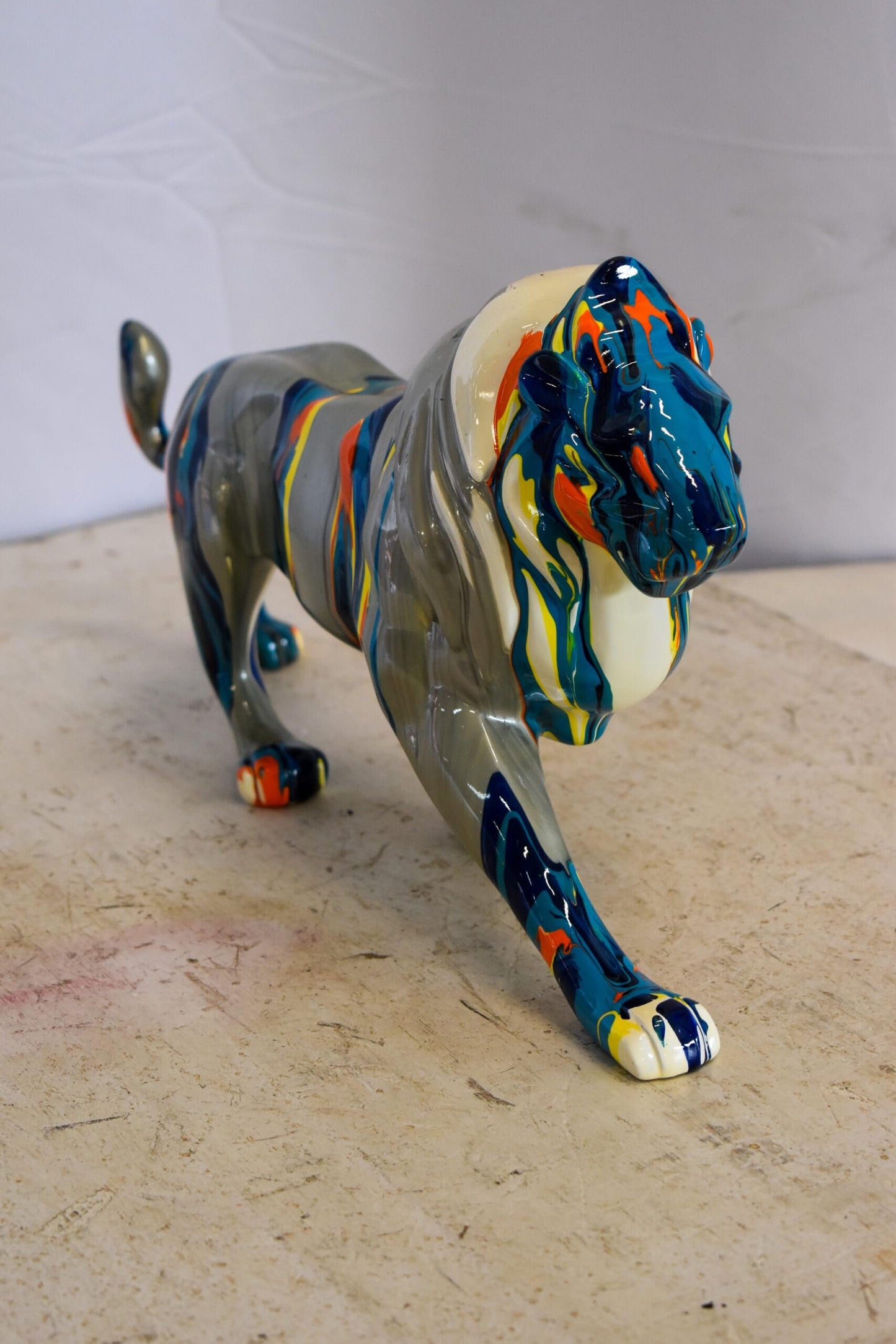 Roaming Multicolored Lion Resin Statue 19" x 5" x 9"H