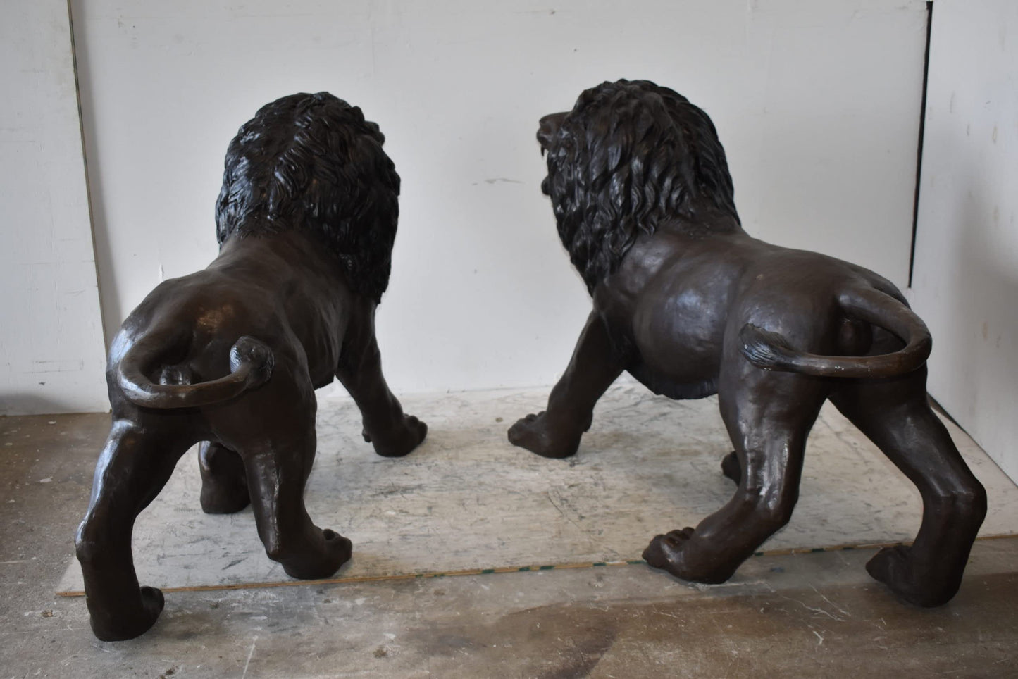 A Pair of Large Lions Walking Side by Side Bronze Statues Size: 24" x 60" x 41"H
